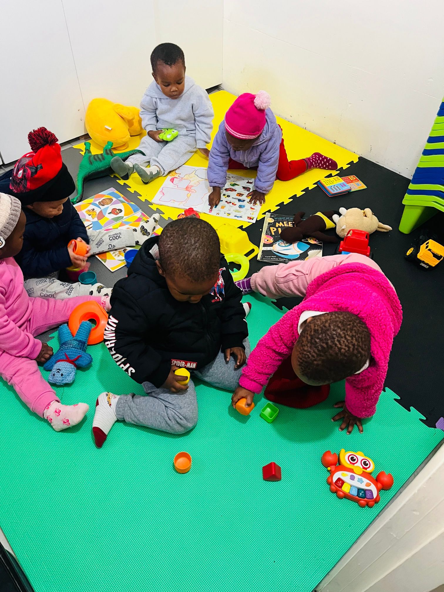 Children exploring toys and creative play activities