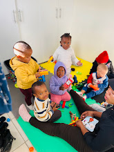 Children doing activities at Munchkins Daycare